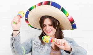 Studio Shot of young woman dancing in sombrero