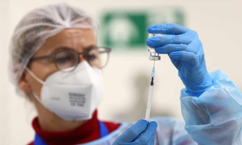 An AstraZeneca vaccine is being prepared at a local vaccination centre in Germany.