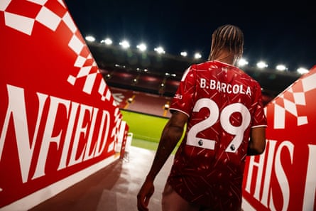 Bradley Barcola pictured walking towards the Anfield pitch