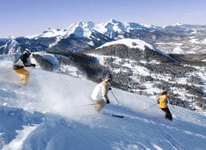 Three friends skiing fresh powderSkiers on Telluride’s Gold Hill with the majestic Wilson Massif in the background