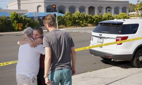 People hug after the synagogue shooting at Poway. An ‘open letter’ by the suspect, John Earnest, says he was inspired by the Christchurch massacre