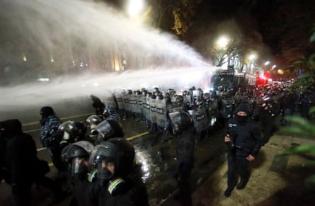 Police use a water cannon to prevent protesters pouring into the streets following Georgian Prime Minister Irakli Kobakhidze’s announcement, rallying outside the parliament building in Tbilisi, Georgia, on Friday, Nov. 29, 2024. (AP Photo/Zurab Tsertsvadze)