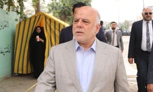 The Iraqi prime minister, Haider al-Abadi, arrives to cast his vote at a polling station on Saturday.