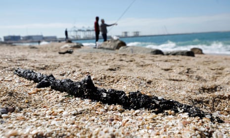 A clump of tar is seen on the sand at Ashdod, southern Israel