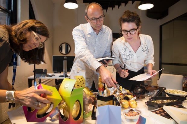  Guardian Australia's self-confessed chocoholics Lucy Clark, Mike Ticher and Bridie Jabour get to it. Photograph: Jonny Weeks for the Guardian