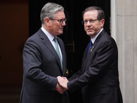 Israeli president Isaac Herzog and prime minister Keir Starmer shake hands outside 10 Downing Street.