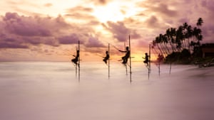 Traditional stilt fishermen try their luck at sunset – Koggala, Sri Lanka: winner of the people and nature category