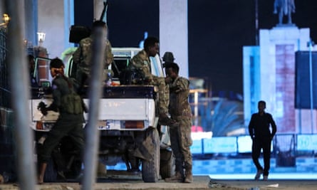 Somali security forces patrol near the Hayat hotel after the attack.