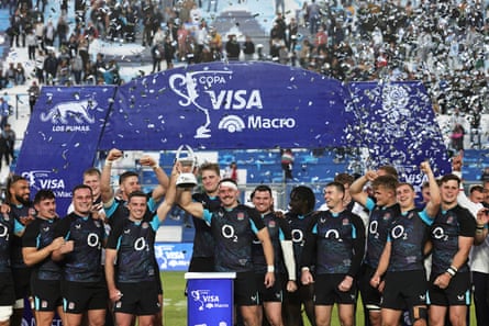 England players celebrate after beating Argentina in San Juan.