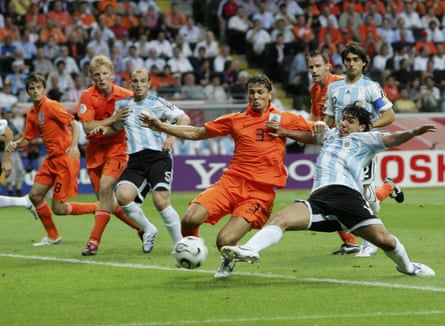 Argentina's Carlos Tevez (right) stretches under pressure from Khalid Boulahrouz at the 2006 World Cup.