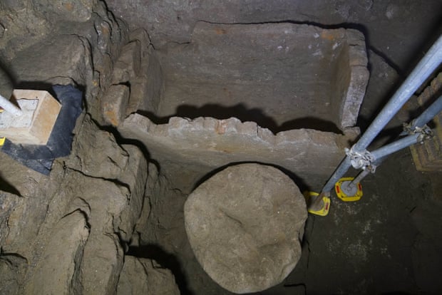 A 1.4-metre (55in) sarcophagus and what appears to be an altar, found in an underground chamber at the ancient Roman Forum.