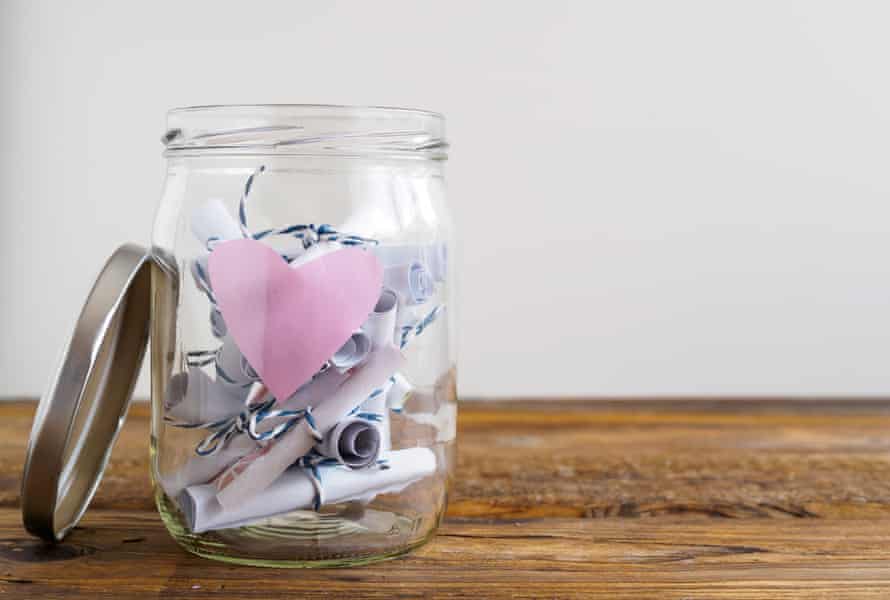 A jar with rolled paper notes.