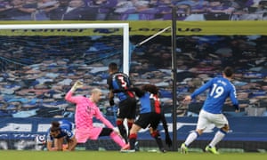 James Rodriguez of Everton scores their team’s first goal past Patrick van Aanholt of Crystal Palace.