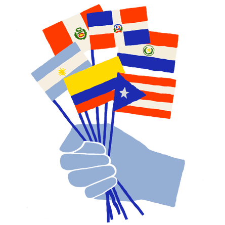Hand holding small Latin American flags