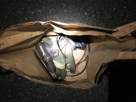 Police photo of a bag containing a drill and wire.