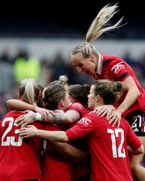 Leah Galton of Manchester United celebrates with team mates after scoring their sides first goal