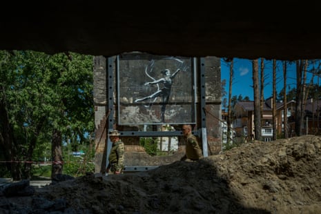 Graffiti by the artist Banksy on a damaged building in Irpin, Ukraine.