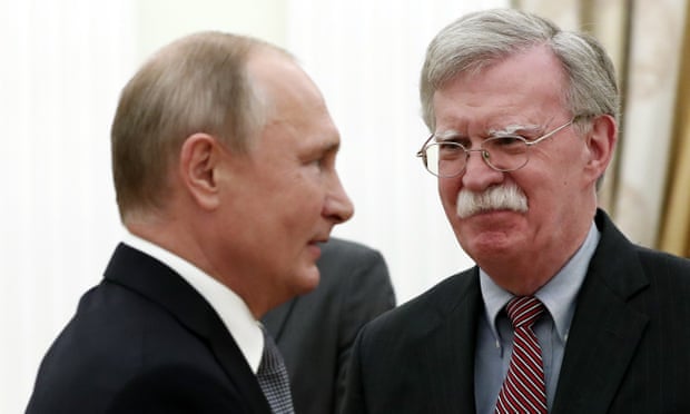 John Bolton (R) meets Vladimir Putin in the Kremlin