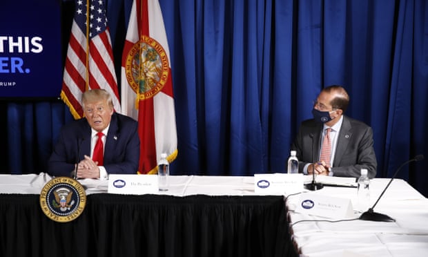 Health secretary Alex Azar listens to Trump speaking in Florida