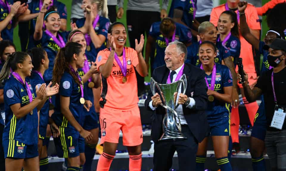 Lyon president Jean-Michel Aulas celebrates with the team after they beat Wolfsburg in the Champions League final in August.