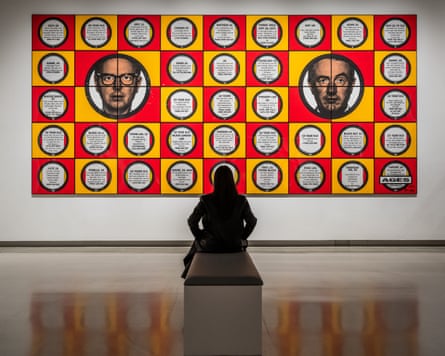 A woman looks at a gilbert and george artwork