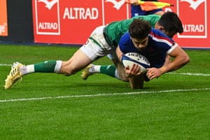 Fly-half Romain Ntamack dives across the line to score France’s third try.