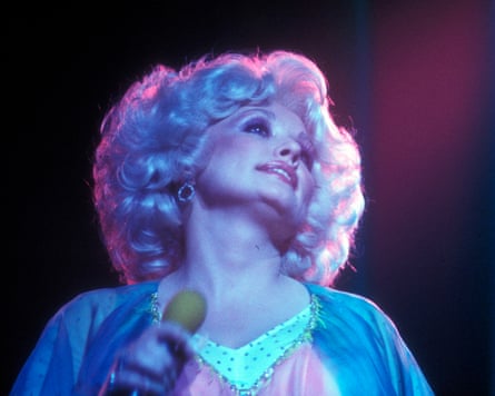 a woman with blonde curly hair