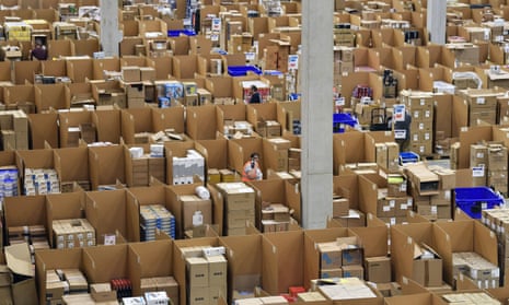 Workers surrounded by boxes in a warehouse
