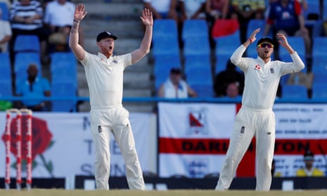 England’s Ben Stokes and Joe Root and react as Anderson goes close.