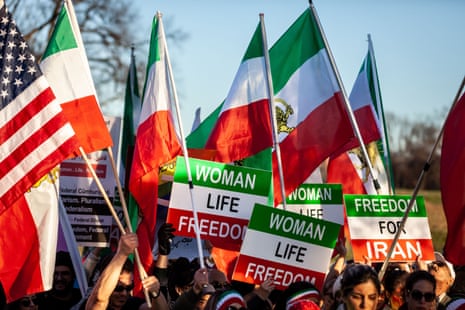 People march near the Washington monument during an event in support of protesters in Iran on 26 November 2022.