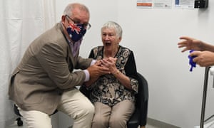 Scott Morrison and aged care resident Jane Malysiak jostle over a ‘V’ sign.