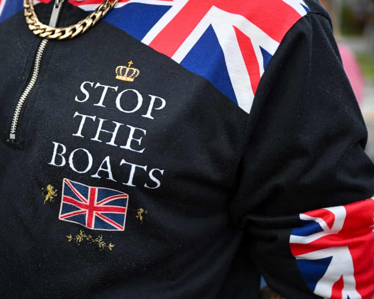 A close-up of jacket emblazoned with union flags and the words ‘stop the boats’