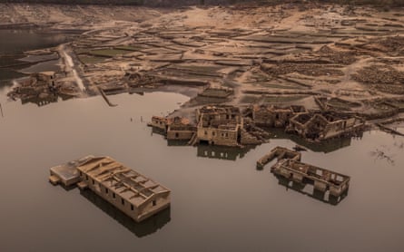 A picture taken with a drone of houses of the village of Aceredo, in Galicia, Spain, which was submerged due to the construction of a reservoir in 1992, and resurfaced due to a drought in 2022