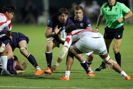 Jason Damm drives on against Japan.