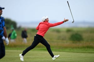 Rory McIlroy fails to catch his club after tossing it in the air.