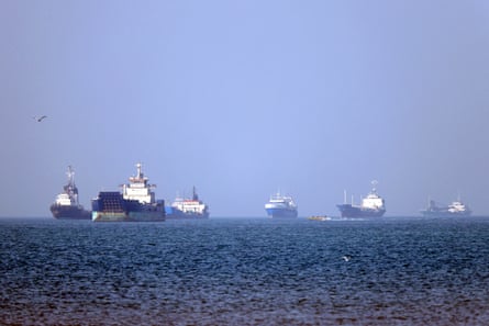 Cargo ships anchored at sea