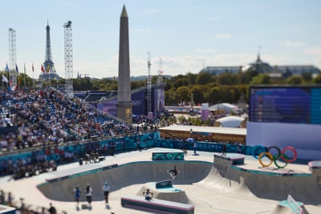 Sky Brown’s fellow competitors watch on as she warms up for the final medal round of the women’s park skateboarding event.