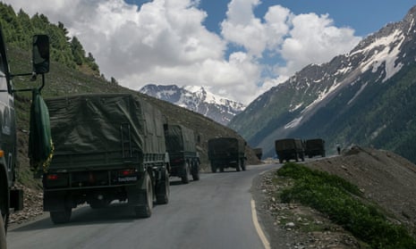 An Indian army convoy, carrying reinforcements and supplies, travels along a mountain pass bordering China in Ladakh, India.