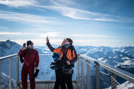 Tourists take a selfie at the highest point in the ski resort of L’aiguille Rouge, 3,226 metres.
