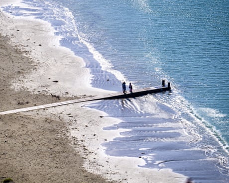 Coronavirus outbreak, Wellington, New Zealand - 13 Apr 2020Mandatory Credit: Photo by Dave Lintott/REX/Shutterstock (10611359c)
People walk on Lyall Bay beach on Easter Monday during lockdown for the Coronvirus outbreak.
Coronavirus outbreak, Wellington, New Zealand - 13 Apr 2020