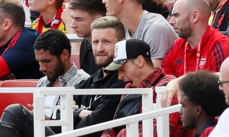 Mohamed Elneny (left) and Shkodran Mustafi (centre) in the stands during Arsenal’s win over Burnley last Saturday.