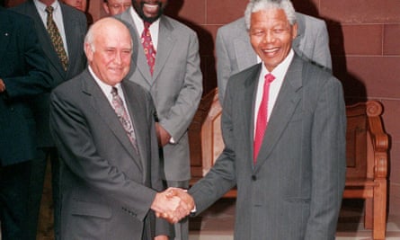 The outgoing South African president, FW de Klerk, shakes hands with his successor, Nelson Mandela, in 1994.