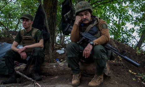 Ukrainian servicemen on the front line near Kharkiv on 11 August. 
