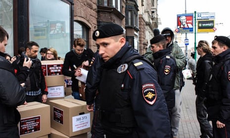 Police in Moscow surround activists and boxes containing petitions calling for an inquiry into a violent crackdown on gay people in Chechnya.