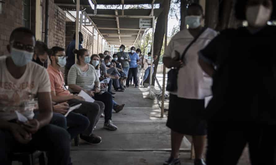 Healthcare workers queue to receive a Johnson & Johnson vaccine at the government hospital in Klerksdorp, South Africa