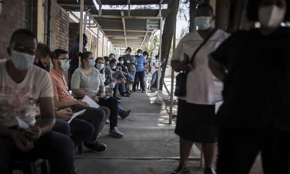 Healthcare workers queue to receive a Johnson &amp; Johnson vaccine at the government hospital in Klerksdorp, South Africa