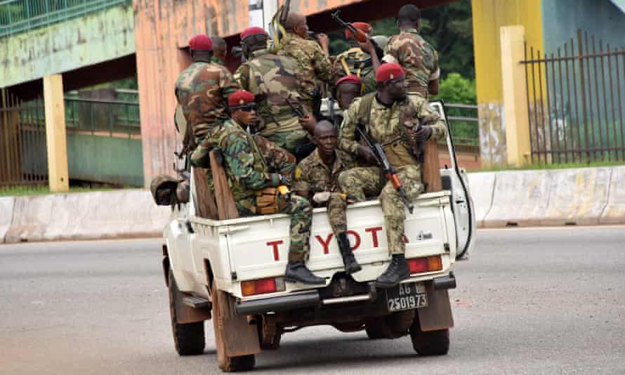 Guinean soldiers in a pickup truck