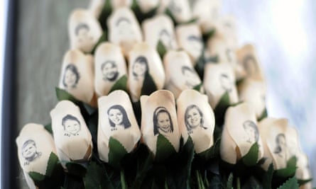 White roses bearing the faces of victims of the Sandy Hook Elementary School shooting.