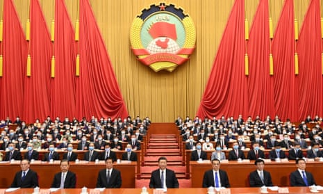 Li Keqiang (front row, third from right) with Xi Jinping (centre) at the opening of the national congress in Beijing on Friday.