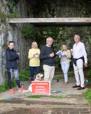 ‘We’ve got to get on with it and take the risk.’ Residents including Sarah Jones second left).